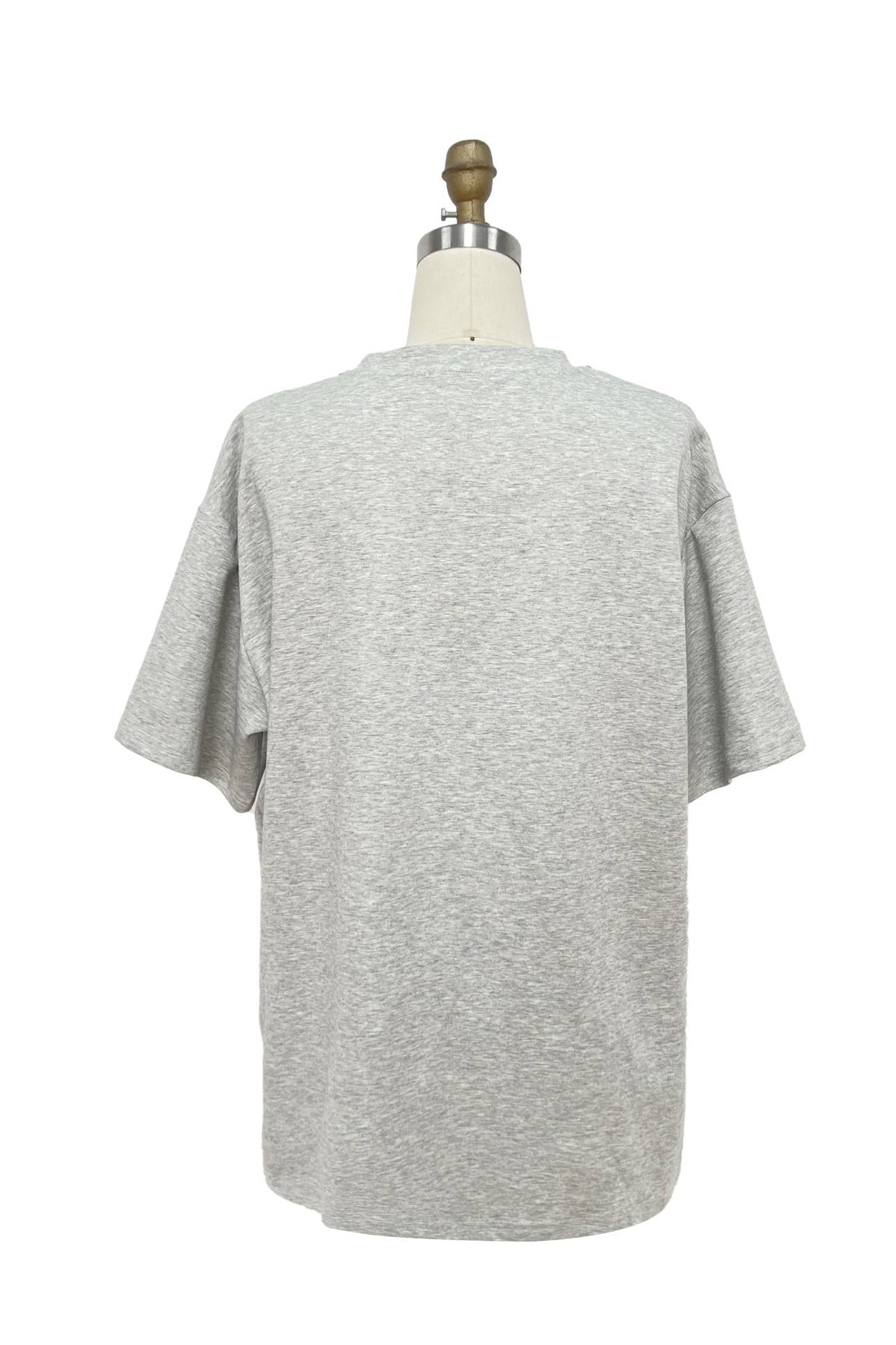 Gray t-shirt on a mannequin against a white background Born To Glam