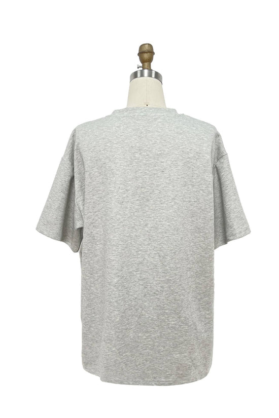 Gray t-shirt on a mannequin against a white background Born To Glam