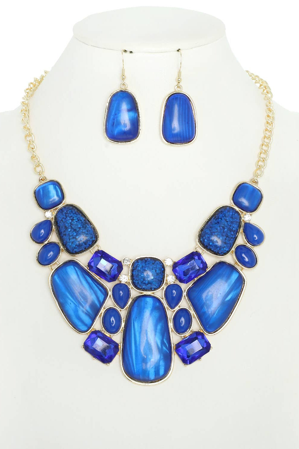 Blue necklace and earrings set on a mannequin with a white background Born To Glam