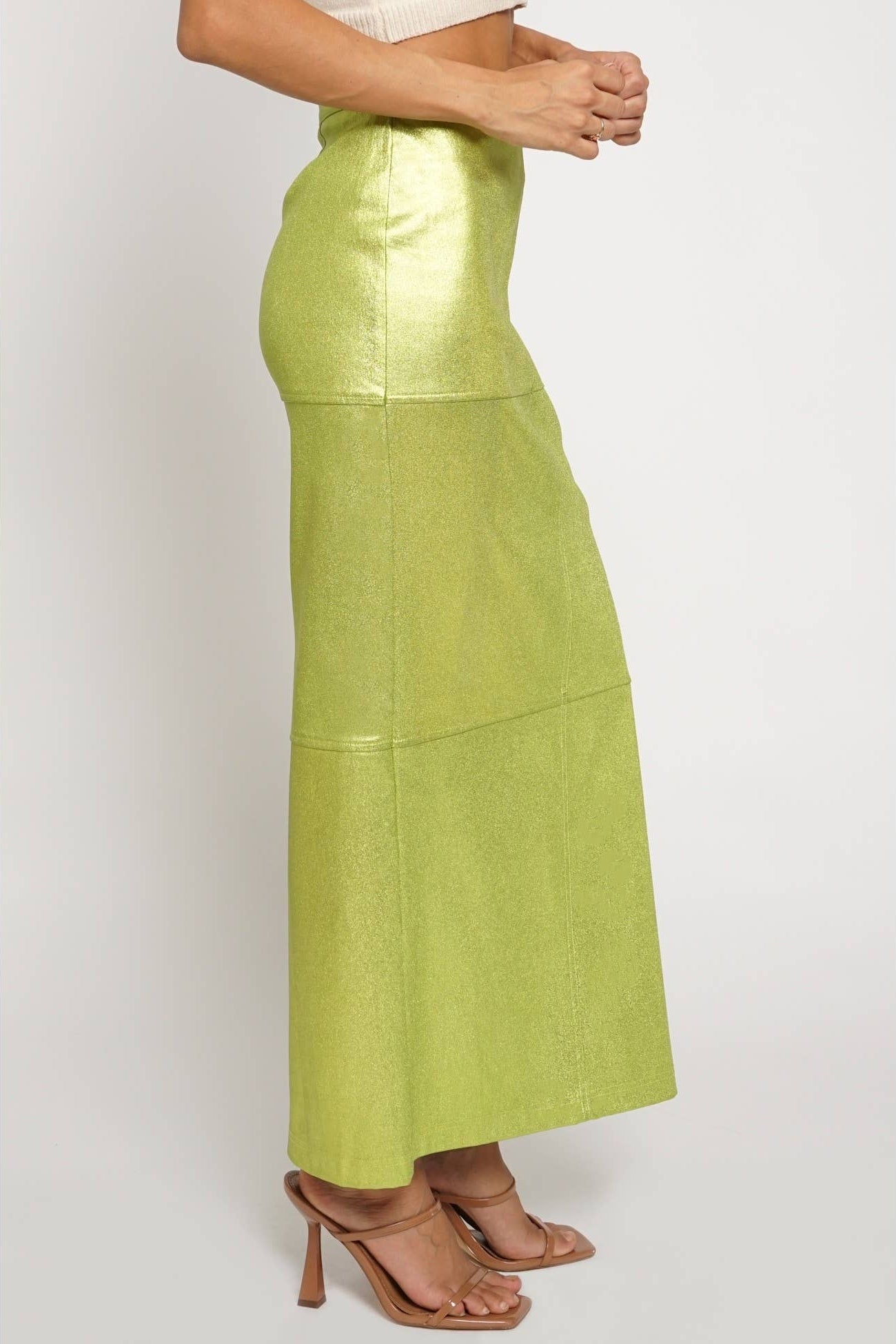 Green skirt worn by a person on a white background Born To Glam