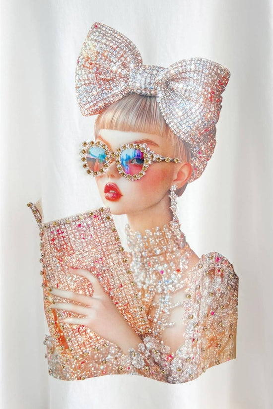 Person wearing a sparkling outfit with a large bow and colorful accessories on a white background Born To Glam