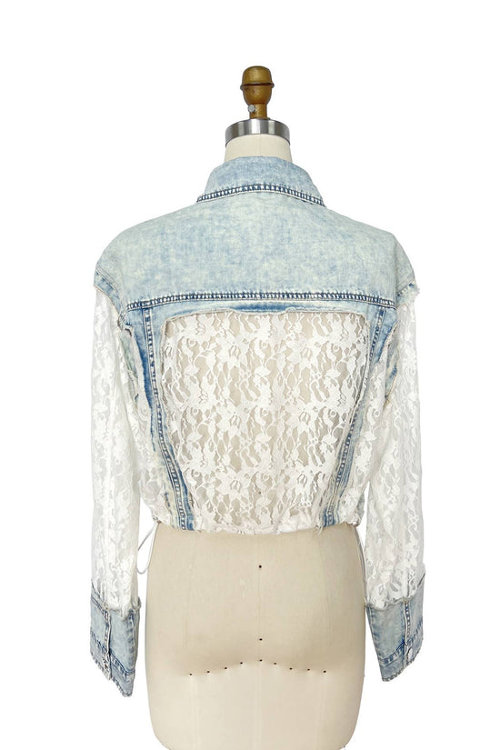 Denim jacket with lace overlay on a mannequin against a white background Born To Glam