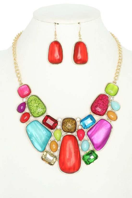 Colorful jewelry set with necklace and earrings on a mannequin. Born To Glam