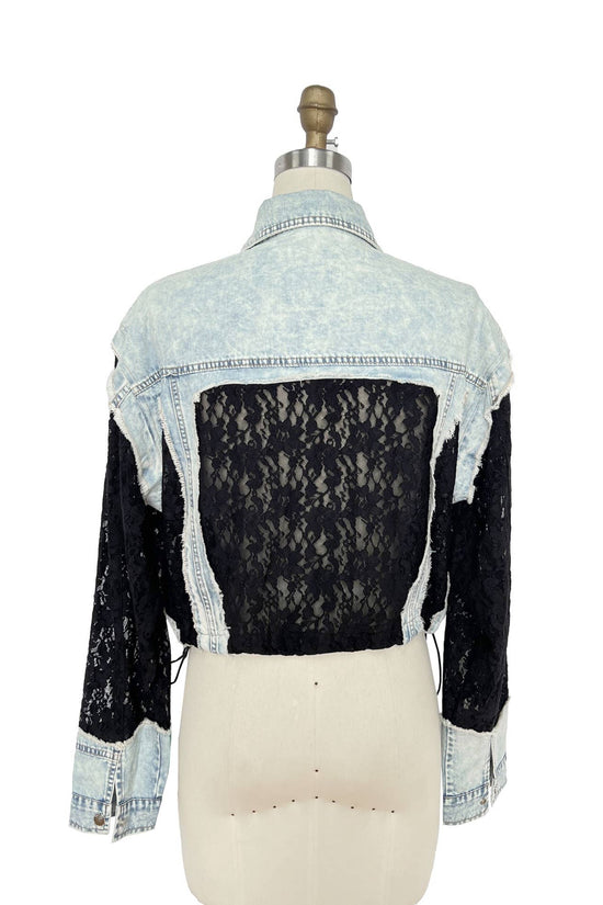 Denim jacket with lace overlay on a mannequin against a white background Born To Glam