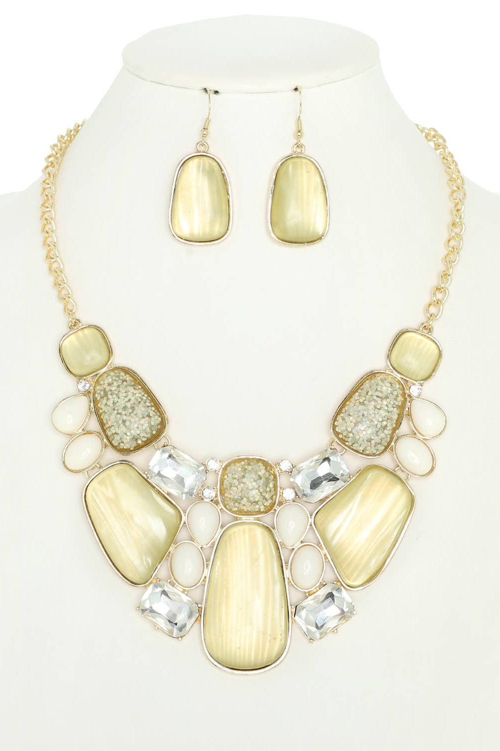 Necklace and earrings set with yellow and gold stones on a mannequin. Born To Glam