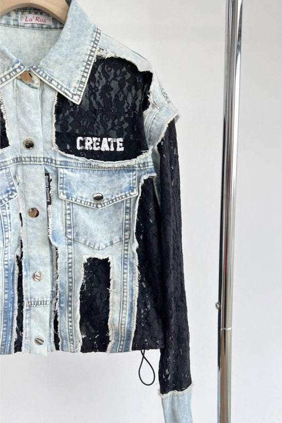 Denim jacket with black distressed design and 'CREATE' text on a white background Born To Glam