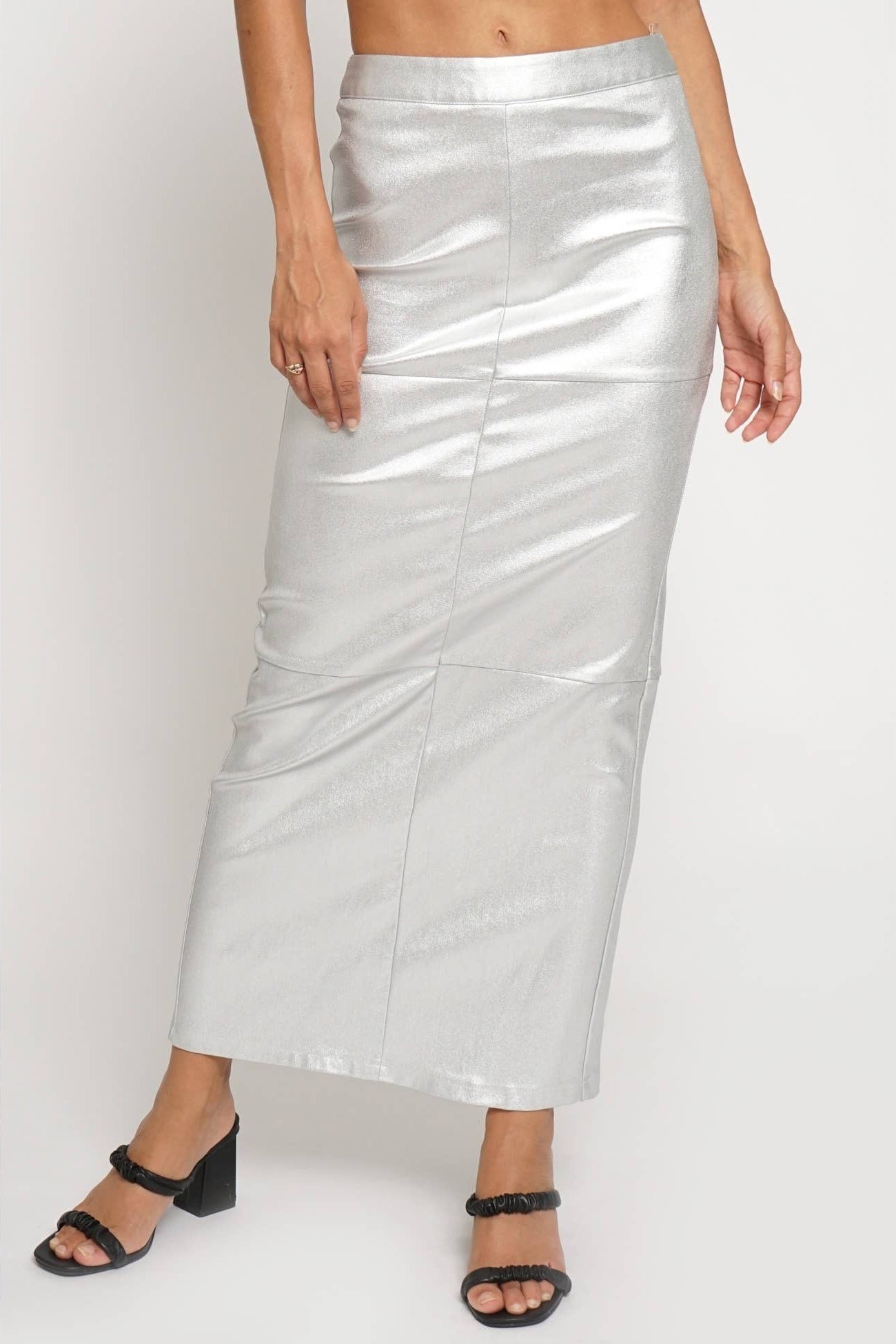Silver metallic skirt worn by a person on a white background Born To Glam