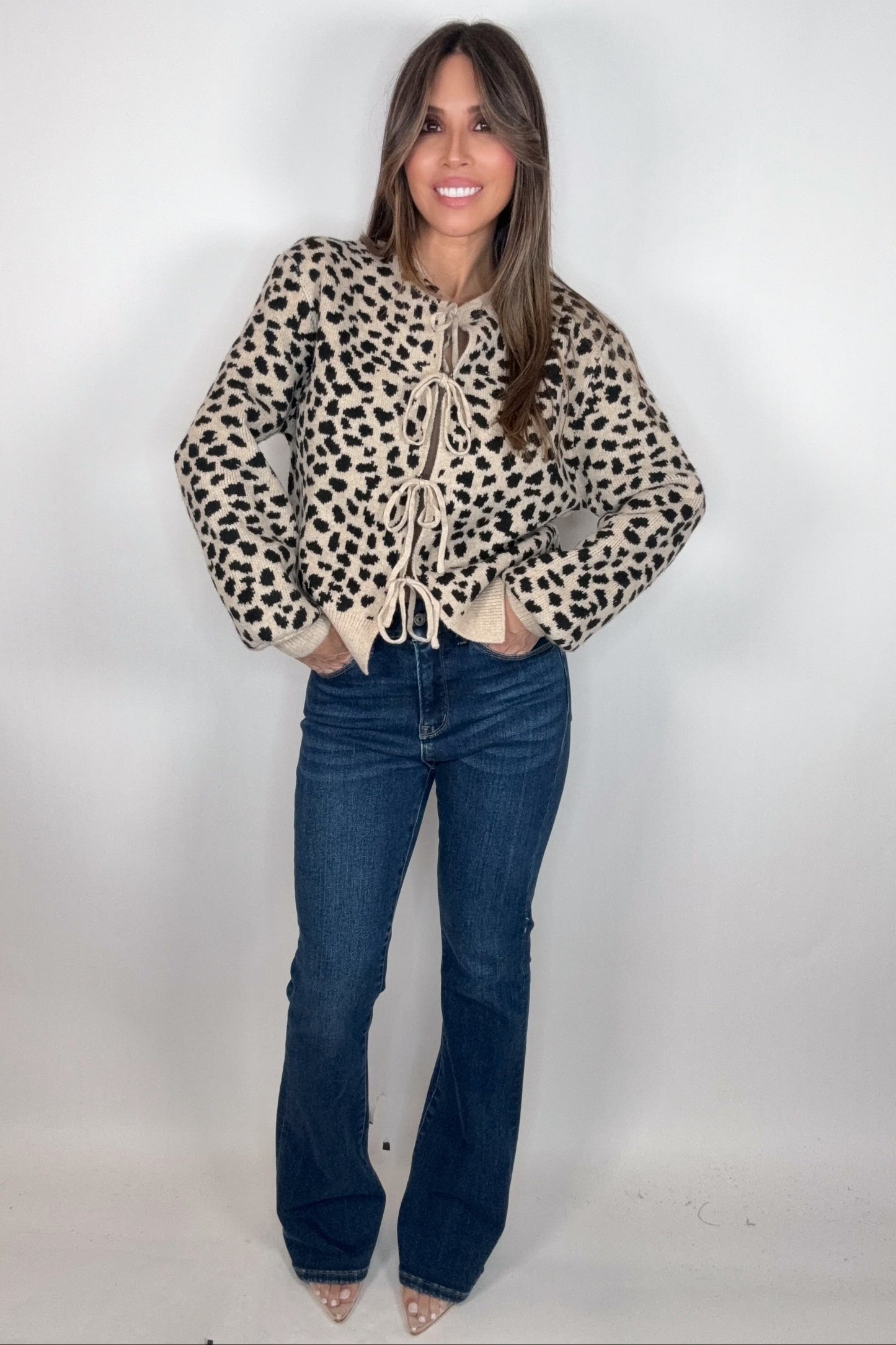 Woman wearing a leopard print jacket and blue jeans on a white background Born To Glam
