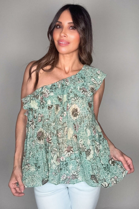 Woman wearing a floral one-shoulder top against a plain background Born To Glam
