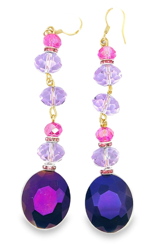 Pair of earrings with purple and pink beads on a white background Born To Glam