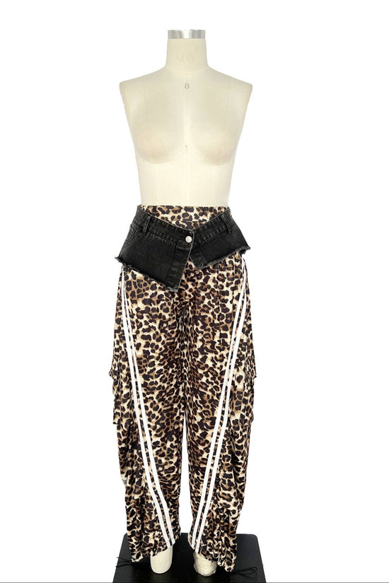 Mannequin wearing leopard print pants with a black belt on a white background Born To Glam